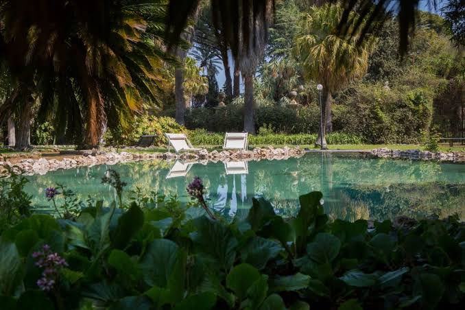 Turquoise pond in the Villa Tasca gardens