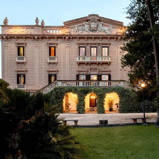 Villa Tasca facade lit at dusk